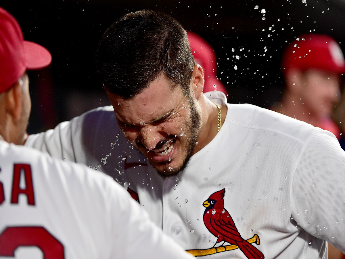 Jun 25, 2021; St. Louis, Missouri, USA;  St. Louis Cardinals third baseman Nolan Arenado (28) is splashed with water by shortstop Edmundo Sosa (63) after hitting a solo home run during the third inning against the Pittsburgh Pirates at Busch Stadium.